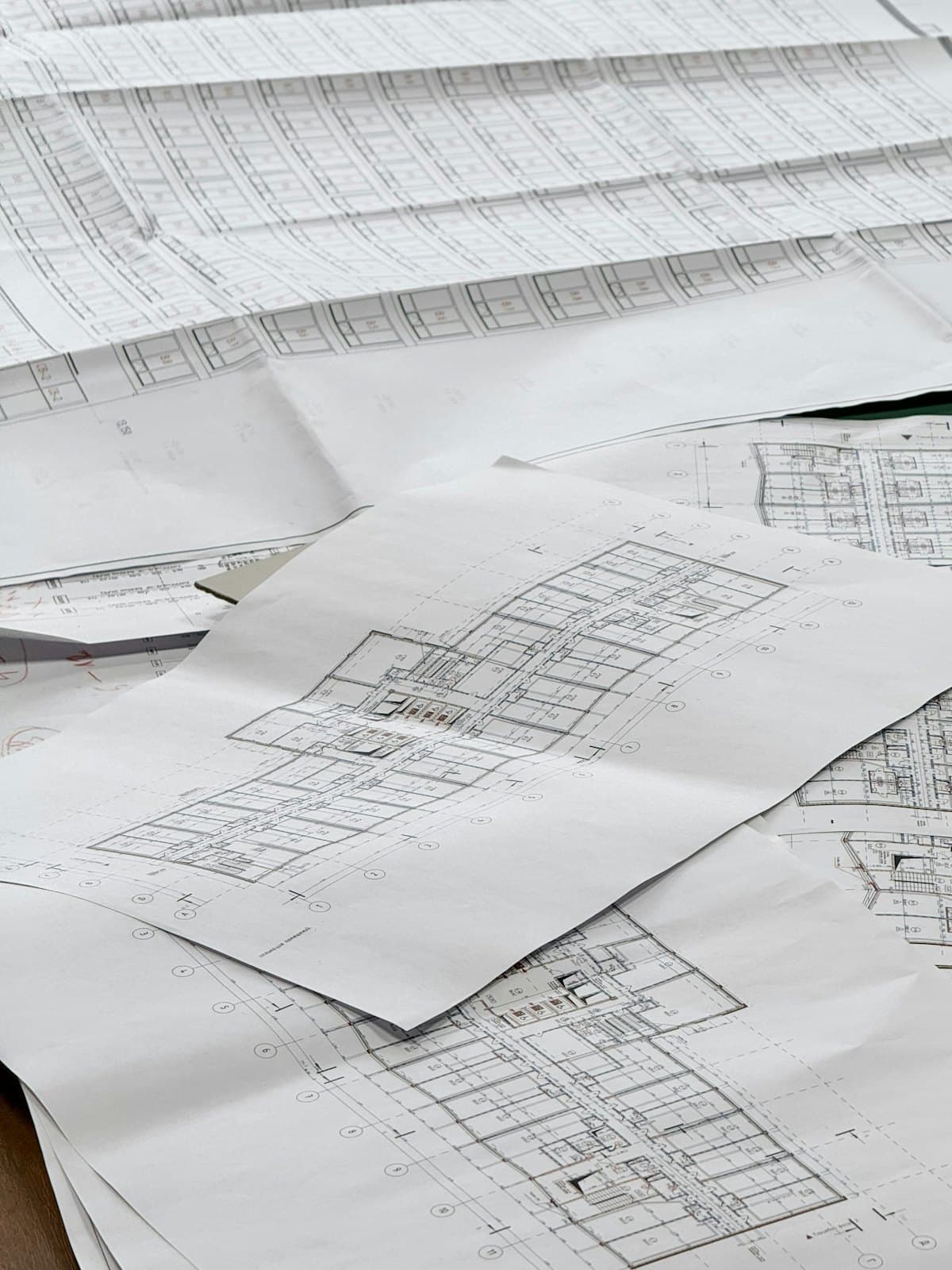 Architectural blueprints spread across a table
