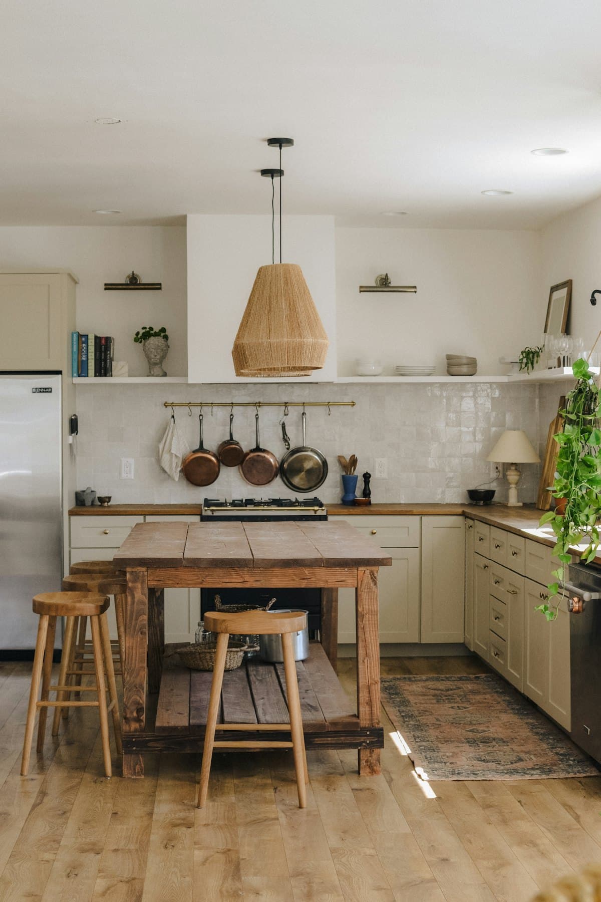 Renovated custom kitchen with wood island and cabinetry